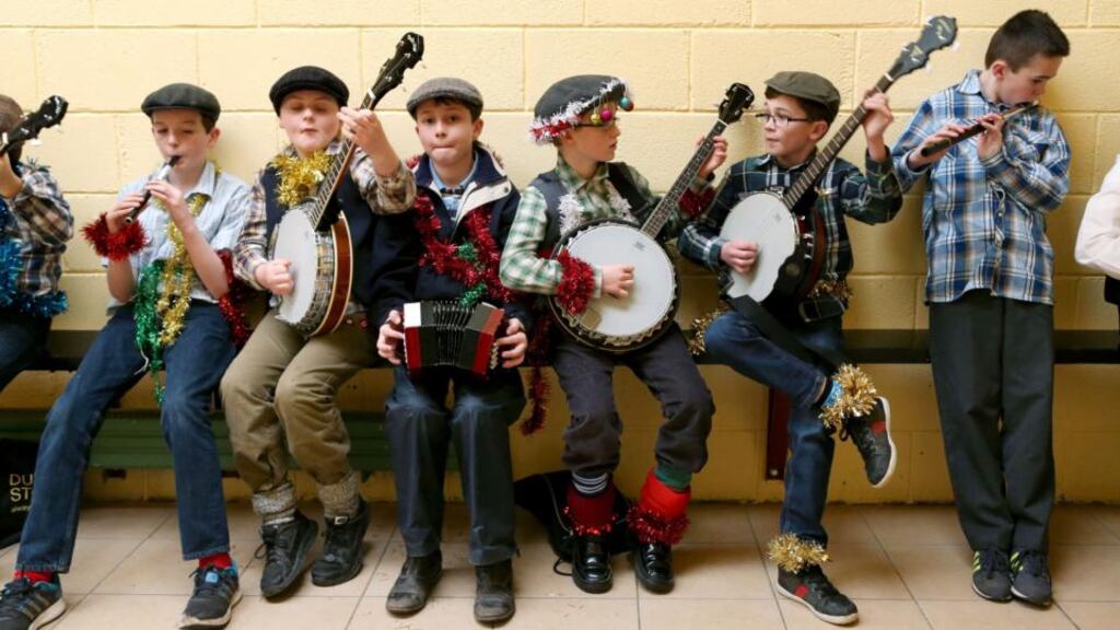 Lakagh Strawboys warm up backstage before taking part in the juvenile competitions at the Galway Mummers Festival in New Inn, Co Galway. Photograph: Joe O’Shaughnessy