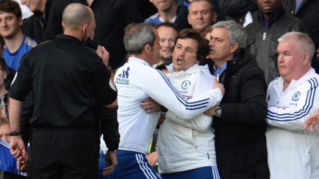 Chelsea’s manager Jose Mourinho  holds back assistant coach Rui Faria  after he was sent off by referee Mike Dean during their  Premier League  match against Sunderland at Stamford Bridge. Photograph: Philip Brown/Reuters