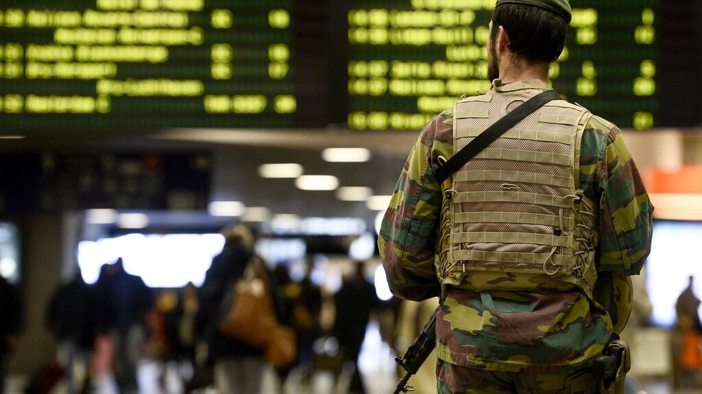 A military police soldier patrols the Brussels Midi train station in Brussels. Belgium’s national security level has been raised to three following the terrorist attacks on Paris. Photograph: Dirk Waem/AFP/Getty Images