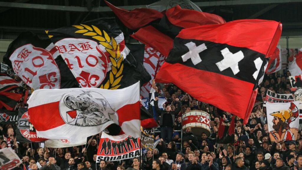 Ajax fans show their support prior to the match between wiith FC Barcelona earlier this month. Photograph: Dean Mouhtaropoulos/Getty Images