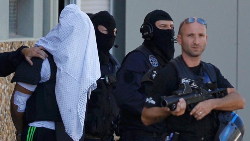 A man supposed to be beheading suspect Yassin Salhi is escorted by police near Lyon, France. Photograph: Emmanuel Foudrot/Reuters