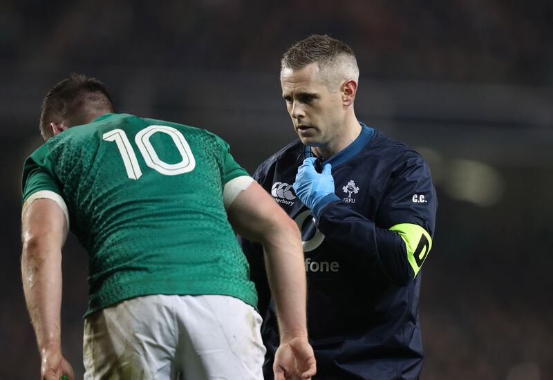 Team doctor Ciaran Cosgrave checks over Johnny Sexton during a clash with the All Blacks last November. Photograph: Billy Stickland/Inpho