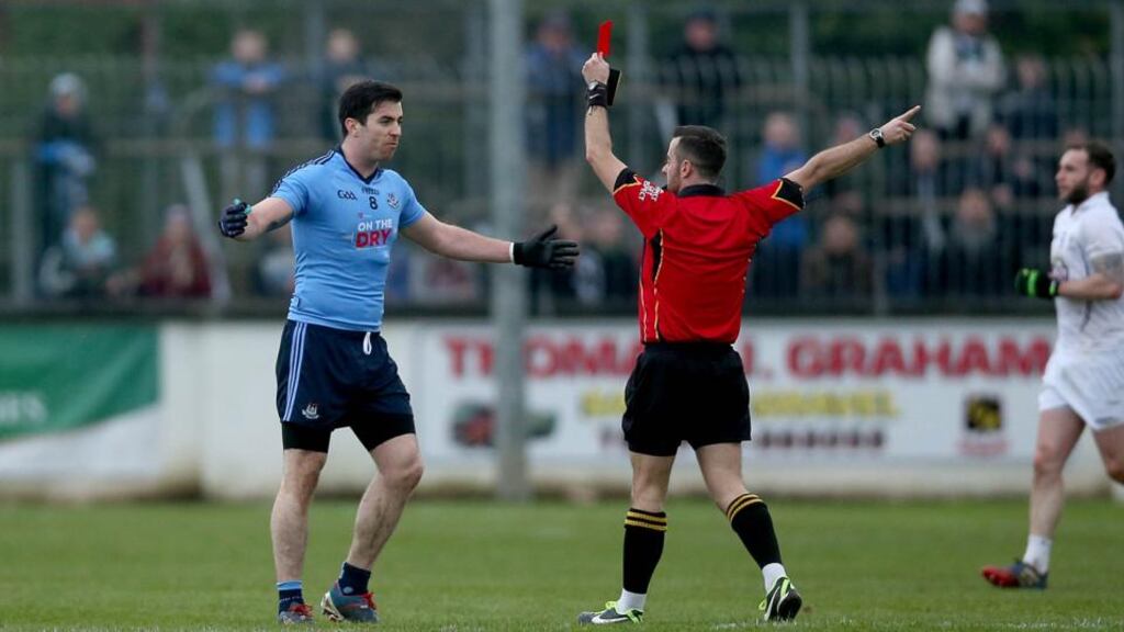 Dublin’s Michael Dara Macauley is sent off late in normal time by referee David Gough during the O’Byrne Cup final against Newbridge. Photo: Donall Farmer/Inpho