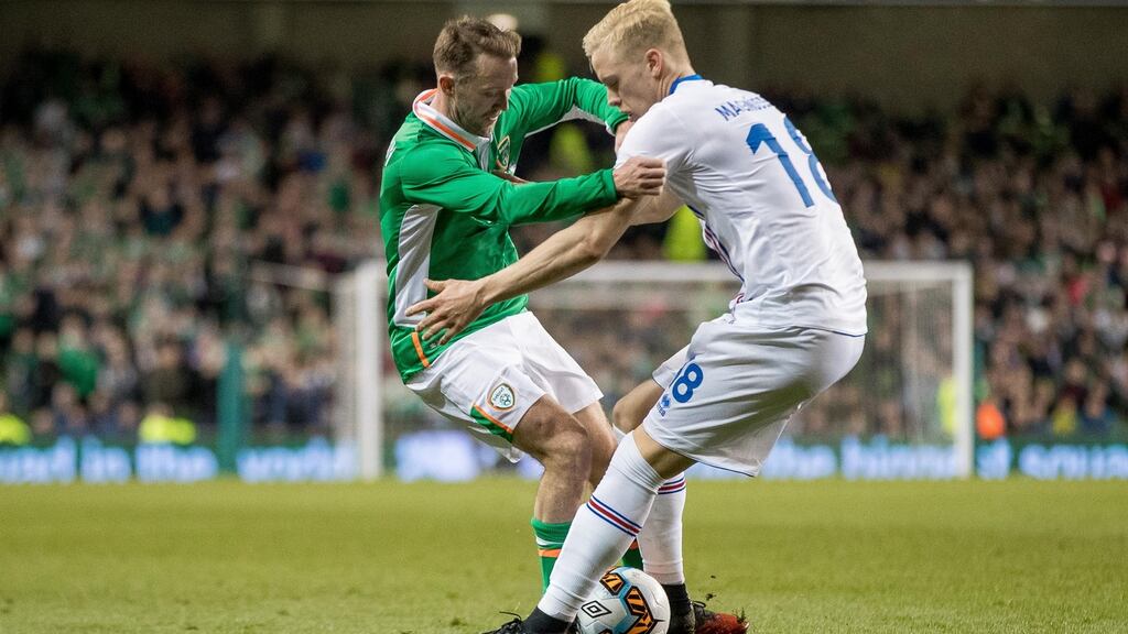 Aiden McGeady battles for the ball with Iceland’s Aron Einar Gunnarsson during the friendly international at the Aviva Stadium. Photograph: Morgan Treacy/Inpho