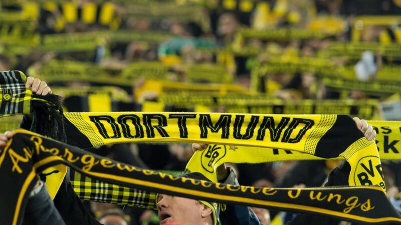 Borussia Dortmund: the club aren’t selling half-and-half scarves for their Europa League match against Red Bull Salzburg. Photograph: TF-Images via Getty
