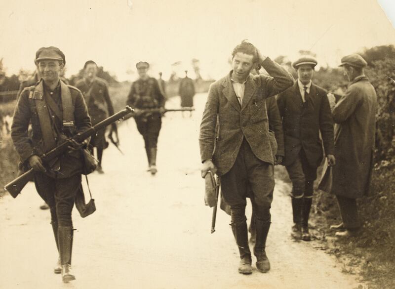 An anti-Treaty IRA prisoner being escorted by National Army soldiers patrolling the Kerry-Limerick border area in 1922. Photograph: National Library of Ireland