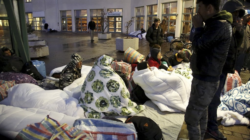 Refugees outside the Swedish Migration Agency’s arrival centre in Malmo. Photograph: Stig-Ake Jonsson/TT News Agency/Reuters