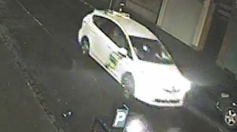 An image of the white taxi released by gardaí.