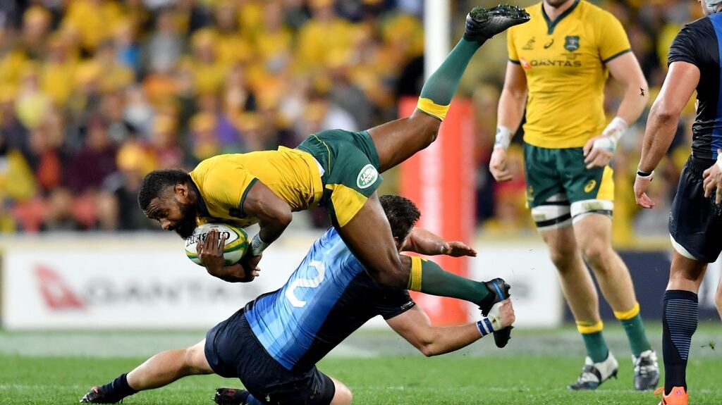 Australia’s Marika Koroibete is tackled by Argentina’s Julian Montoya at Suncorp Stadium in Brisbane, Australia on Saturday. Photograph: Darren England/EPA