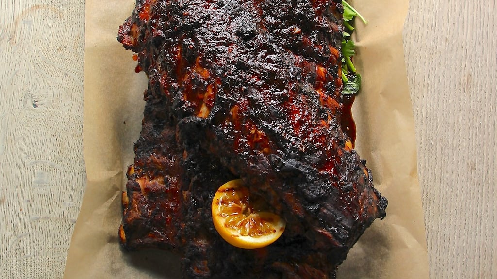 Move the pork on to a chopping board and cut between each rib, using a sharp knife.