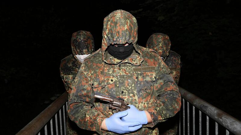 A masked and armed member of the republican dissident group Óglaigh na hÉireann at a show of strength in the Co Derry village of Park. Photograph: Press Eye