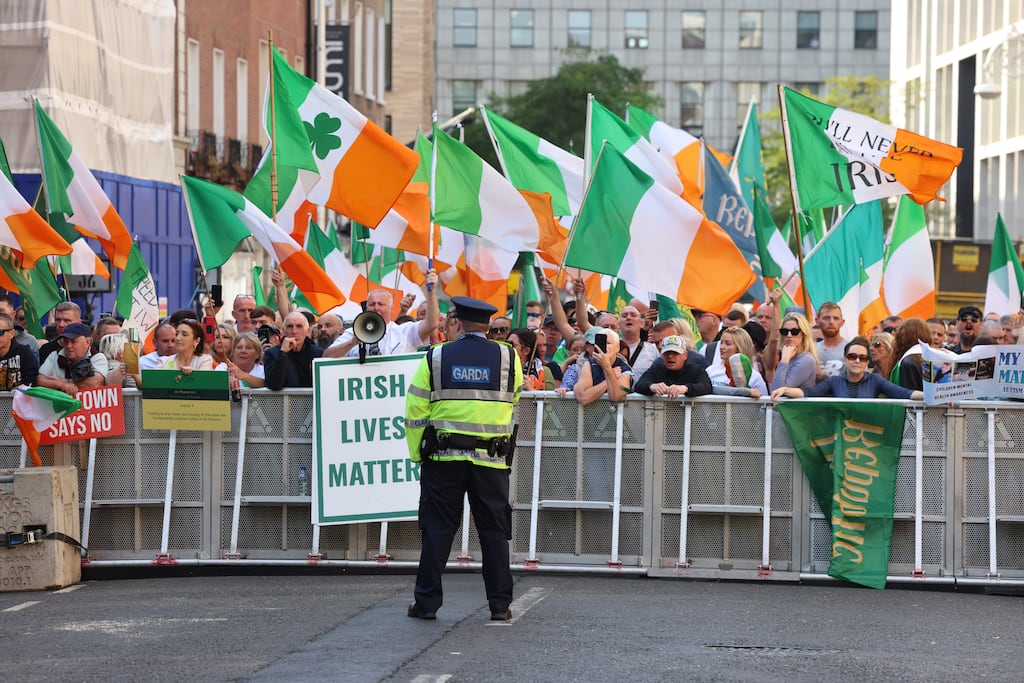 A recent anti-immigration protest on Molesworth Street, in Dublin. Balancing rights around protest is a complex and difficult task, but there are many options available to gardaí. Photograph: Dara Mac Dónaill