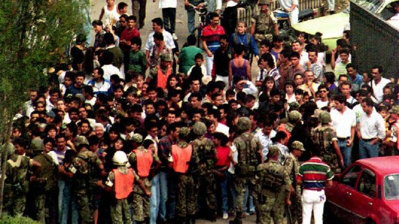 People waiting outside the cemetery in Medellin, Colombia, where the body of Pablo Escobar was being viewed the day after his death in December 1992. Photograph: Roberto Schmidt/AFP/Getty