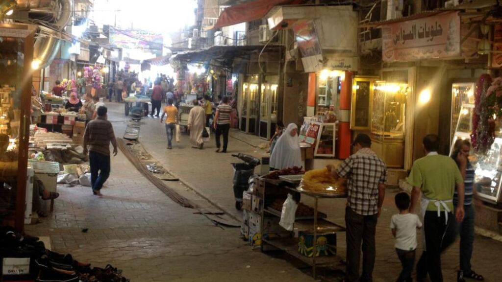 Residents shop at a market Mosul. Sunni insurgents run vice patrols in the city that answer to a morality committee which has shut Mosul’s college of fine arts and physical education, knocked down statues of famous poets and banned smoking and waterpipes. Photograph: Reuters