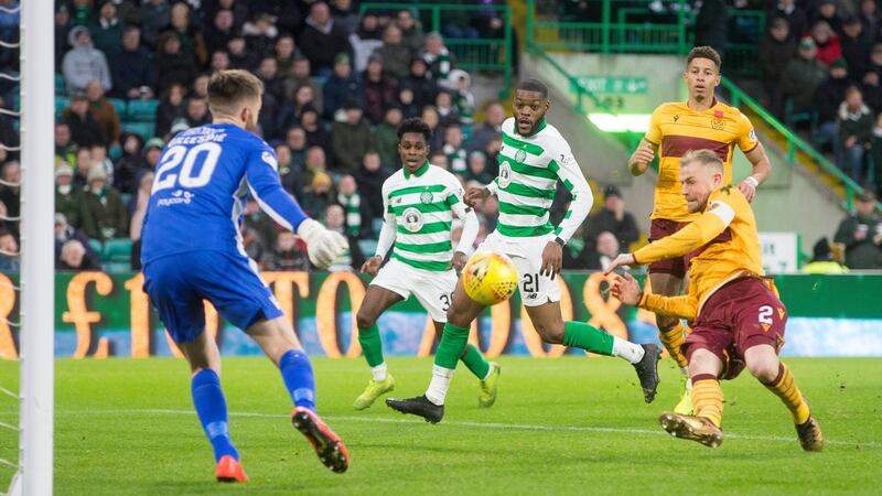 Motherwell’s Richard Tait scores an own goal against Celtic. Photograph: Jeff Holmes/PA