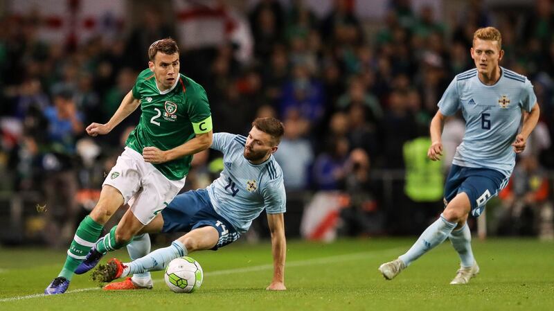 Séamus Coleman skips away from Stuart Dallas during the friendly international at the Aviva stadium. Photograph: Ryan Byrne/Inpho