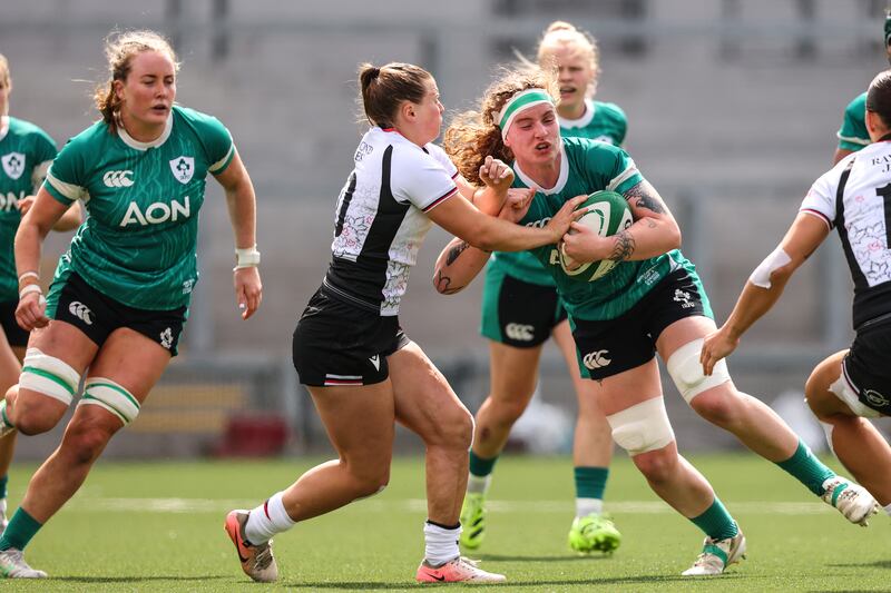Ireland's Ruth Campbell comes up against Claire Gallagher of Canada. Photograph: INPHO/ Ben Brady