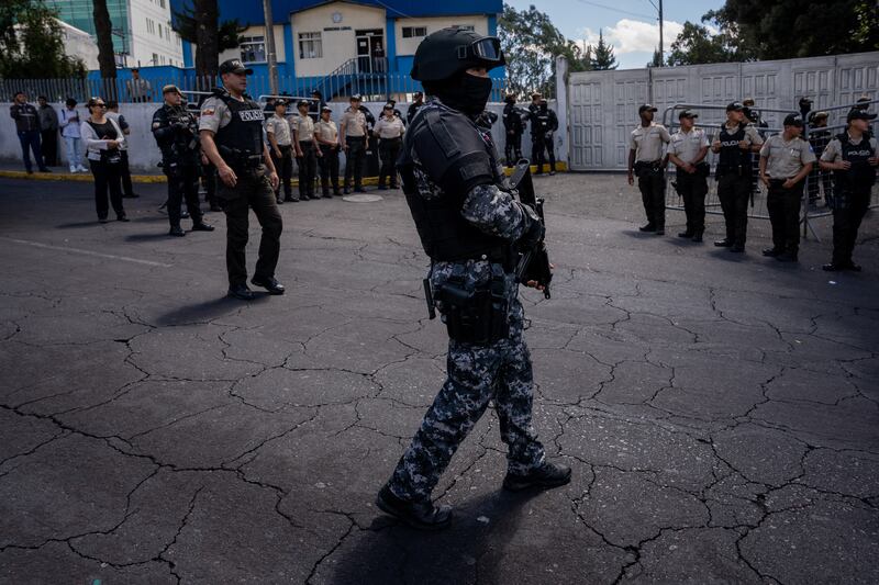 Police guard a hearse carrying the body of the assassinated presidential candidate Fernando Villavicencio in Quito, Ecuador. Photograph: Johanna Alarcon/New York Times