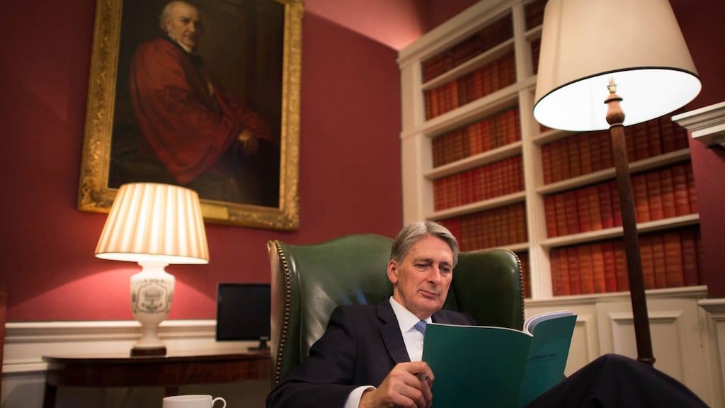 British chancellor of the exchequer Philip Hammond looks over his autumn statement in his office at 11 Downing Street  on Wednesday. Photograph: Stefan Rousseau/AFP/Getty Images