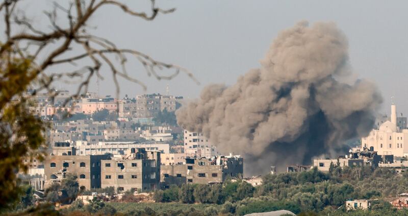 Smoke rises from the northern part of the Gaza Strip as a result of an Israeli explosion. Photograph: Hannibal Hanschke/EPA