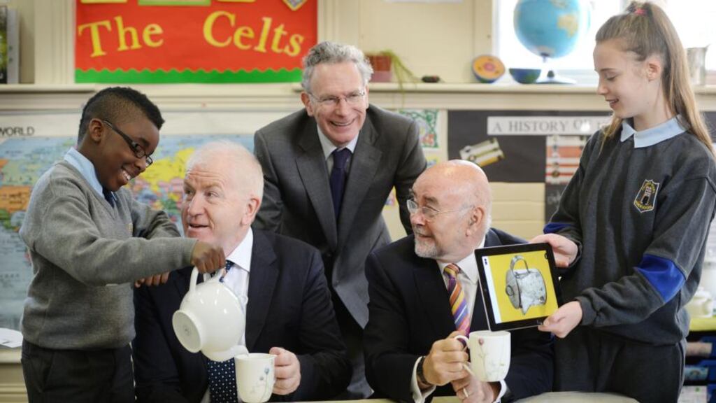 Presley Ogedegbe and Caitlin Whelan from 6th Class at the Model School on Marlborough Street launching new lesson plans for primary schools with Minister for Arts Jimmy Deenihan, Minister for Education Ruairi Quinn and Fintan O’Toole, author of a History of Ireland in 100 Objects. Photograph: Alan Betson / The Irish Times