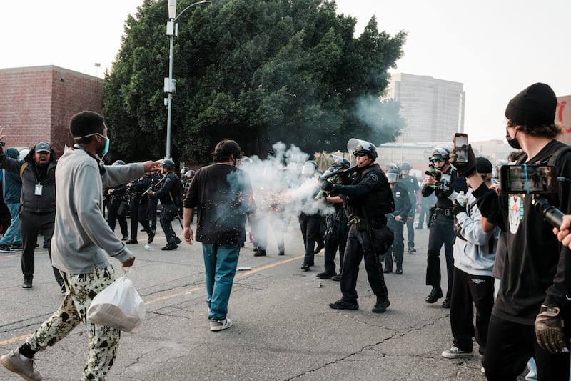 Los Angeles police and protesters clash amid protests condemning immigration-enforcement operations. Photograph: Gabriela Bhaskar/The New York Times