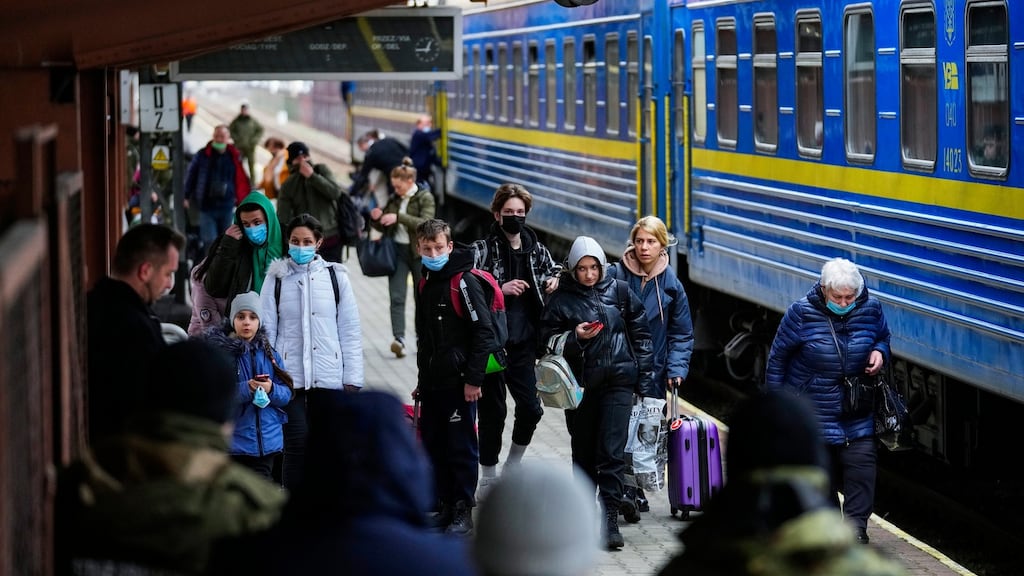 The Reuters news agency reported that social media groups had begun dispensing advice on how to leave Russia while one news site in Russian gave a list of 'where to run away right now from Russia'. Photograph: Petr David Josek/AP