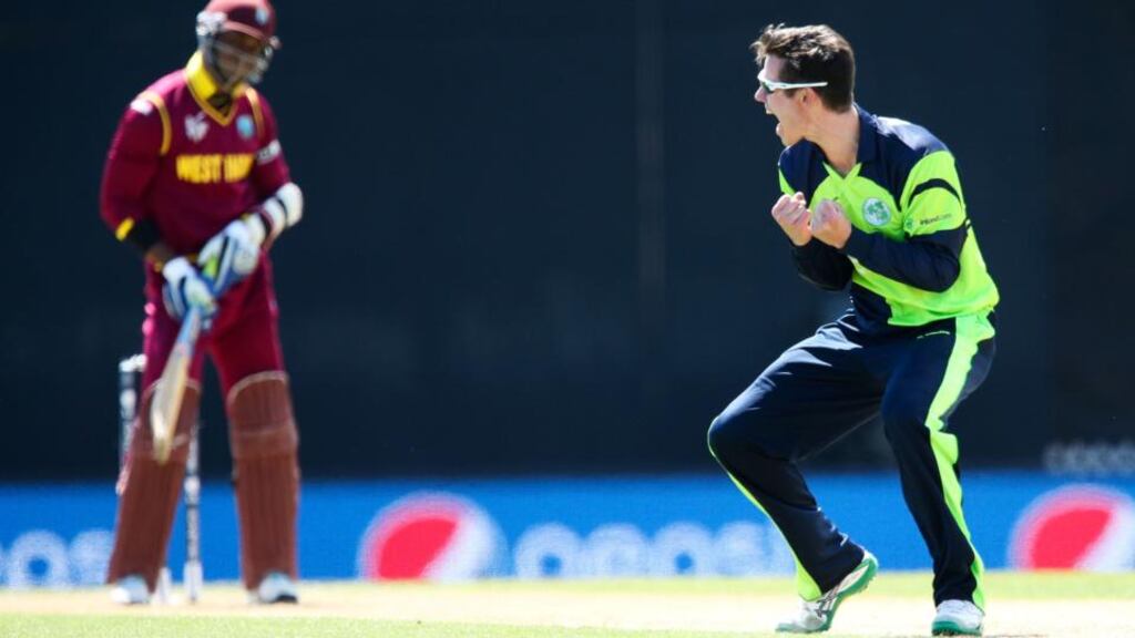 George Dockrell celebrates after taking the wicket of Marlon Samuels of the West Indies. Photograph: Hagen Hopkins/Getty Images