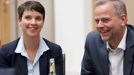 Merkel’s refugee policy under pressure after shock defeat