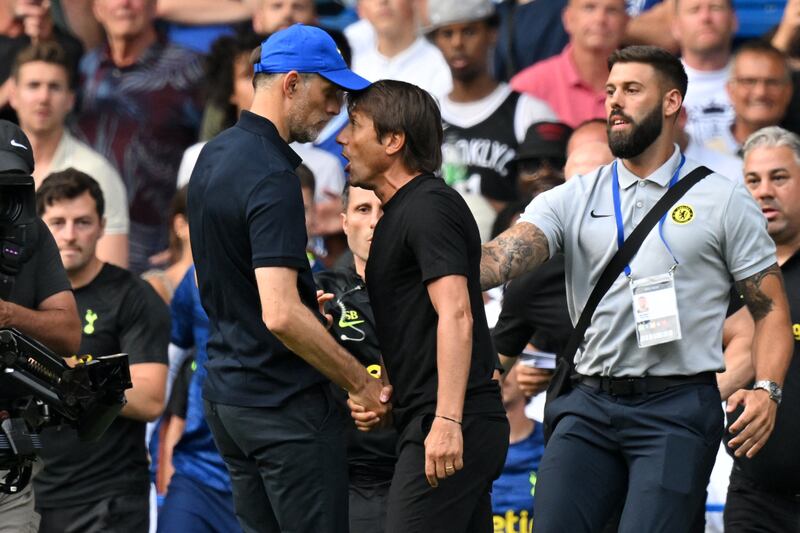 Tottenham Hotspur's Italian head coach Antonio Conte (R) and Chelsea's German head coach Thomas Tuchel (L) shake hands then clash after the English Premier League football match between Chelsea and Tottenham Hotspur at Stamford Bridge in London on August 14, 2022. - The game finished 2-2. Photo by GLYN KIRK/AFP via Getty Images)
