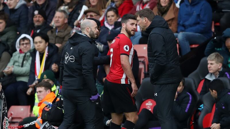 Shane Long is forced off during Southampton’s win over Spurs. Photograph: Christopher Lee/Getty