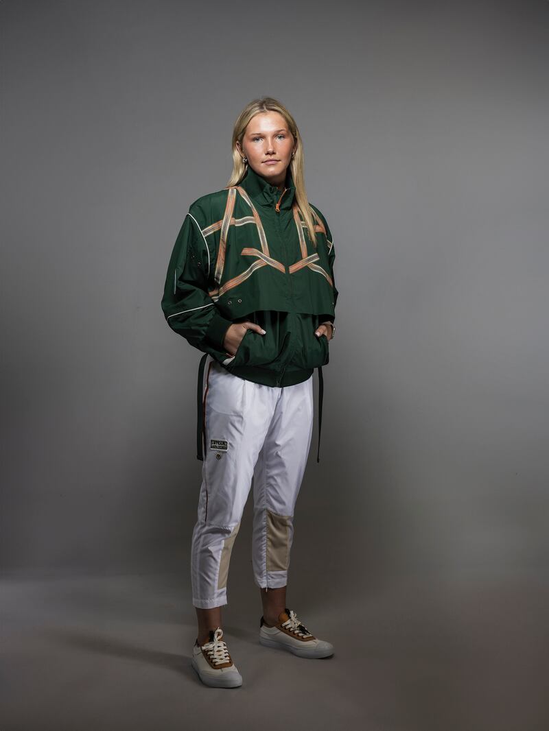 Alanna Fitzpatrick, rugby player, wearing closing ceremony green jacket
