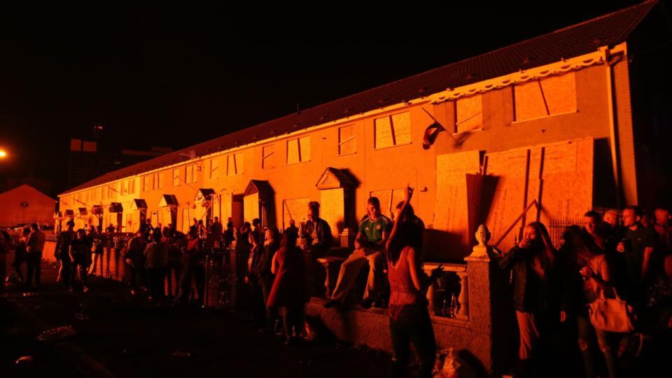 Houses are boarded up to protect them from a bonfire in the shankill area of Belfast on Eleventh Night. Photograph: Niall Carson/PA Wire