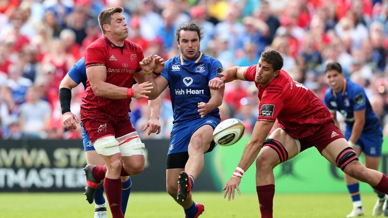 Leinster’s James Lowe kicks ahead under pressure from CJ Stander and Gerbrandt Grobler during their one-point victory over Munster at the RDS. Photograph: Billy Stickland/Inpho