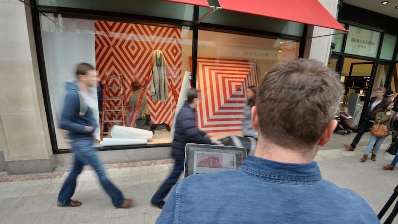 Maser (denim shirt) working on his installation. Photograph: Alan Betson