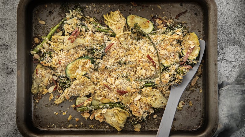 Crusted summer greens with lemon, artichoke and salami. Photograph: Harry Weir