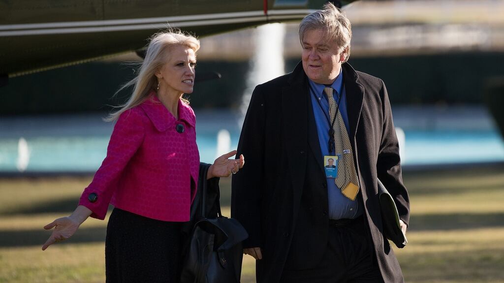 Kellyanne Conway (L), an adviser to Donald Trump, and the president’s chief strategist Steve Bannon walk toward the Oval Office on the South Lawn of the White House on Thursday. Photograph: Drew Angerer/Getty Images.