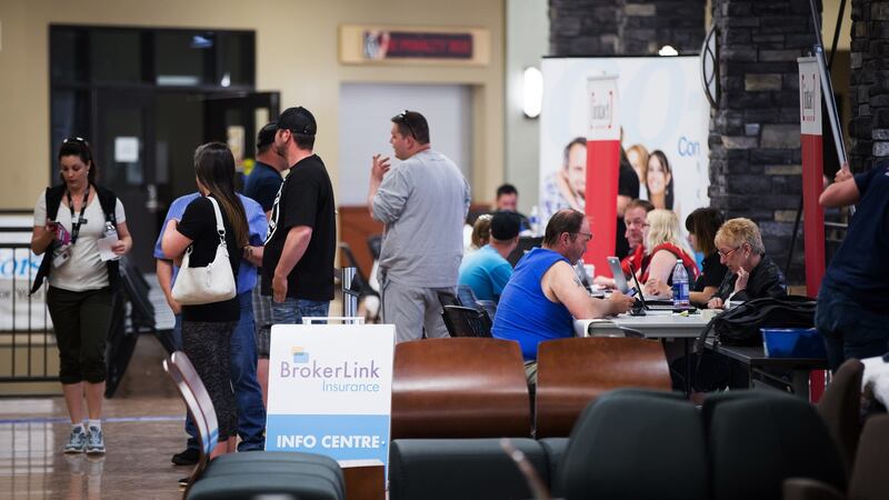 Fort McMurray wildfire evacuees wait to speak with insurance company representatives at an evacuation centre in Lac La Biche, Alberta, Canada, on Saturday. Photograph: Darryl Dyck/Bloomberg