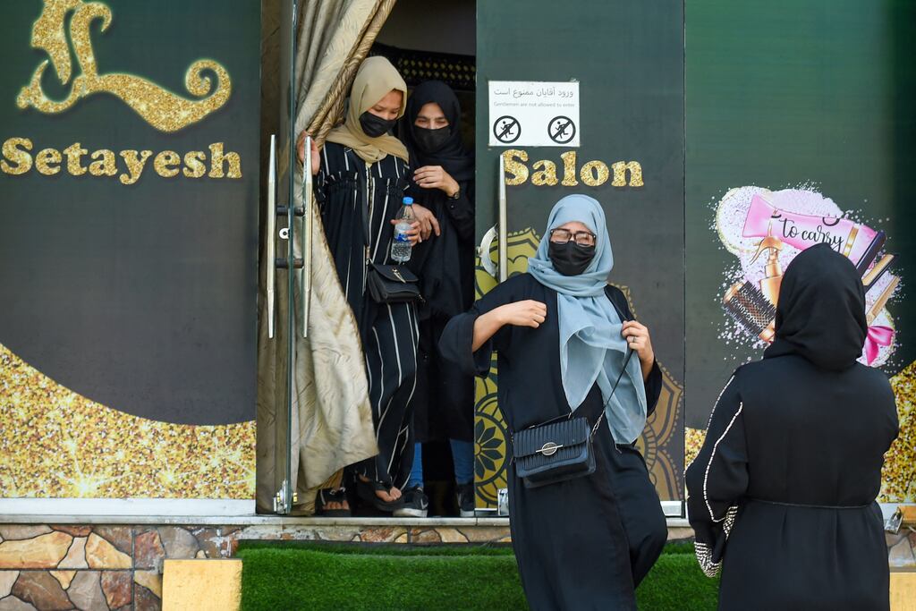 Afghan burqa-clad women stage a protest for their rights at a beauty salon in the Shahr-e-Naw area of Kabul on Wednesday. Taliban authorities have ordered beauty parlours across the country to shut by August 2nd. Photograph: AFP via Getty Images