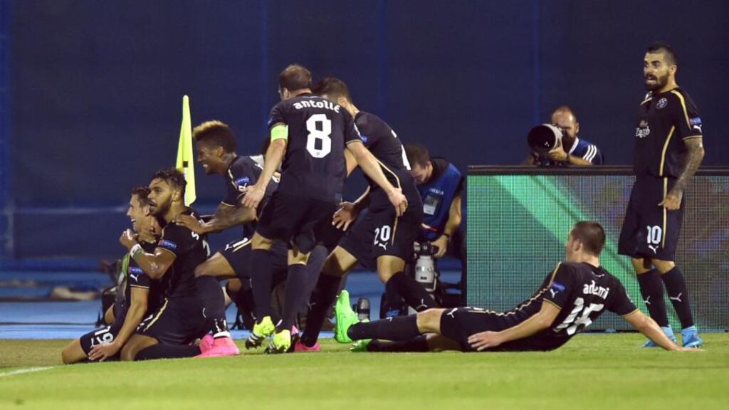 Dinamo Zagreb’s players celebrate after scoring their first goal in the Champions League Group F match against Arsenal at Maksimir Stadium in Zagreb. Photograph: Andrej Isakovic/AFP/Getty Images