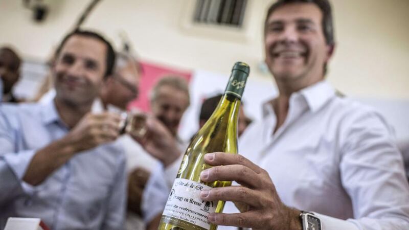 Vintage humour: Arnaud Montebourg with his Cuvée du Redressement. Photograph: Jeff Pachoud/AFP/Getty