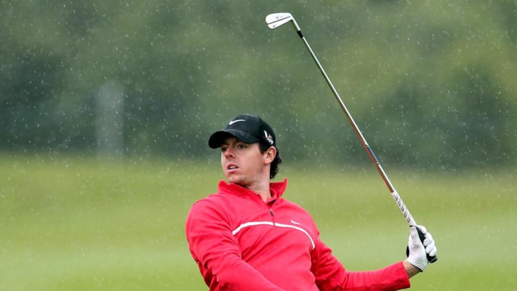 Rory McIlroy hitting his third shot to the fourth green at Carton House. The Co Down man opened with two bogeys in the first three holes. Photograph: ©INPHO/Cathal Noonan