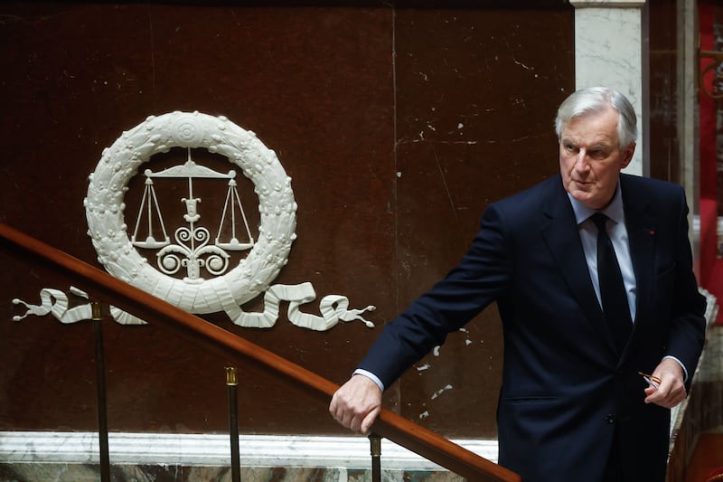 French Prime Minister Michel Barnier leaves the podium after delivering a speech as part of the French National Assembly debate on parts of France's 2025 budget bill, in Paris, France, 02 December 2024. Prime Minister Barnier activated Article 49.3 of the Constitution to pass his social security budget bill without a vote, as a majority of members of Parliament rejected his project on 02 December 2024.