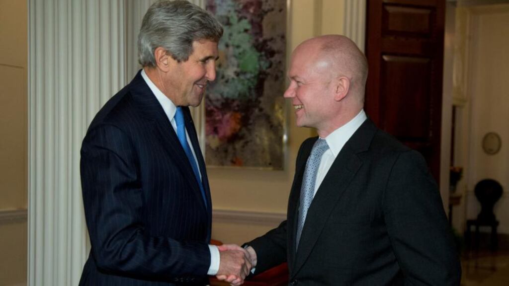 US secretary of state John Kerry (left) shakes hands with British foreign secretary William Hague at the residence of the US ambassador to Britain, in London, yesterday. Photograph: AP Photo/Carolyn Kaster