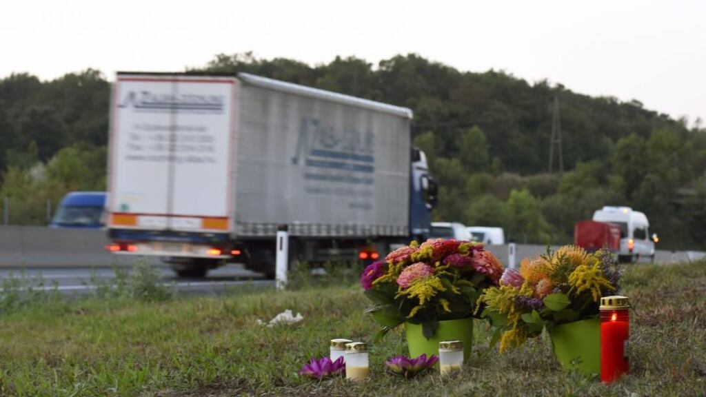 Flowers and candles at the side of motorway where a group of migrants were found dead in a truck in Austria. Austrian police have discovered another lorry containing three children in a critical condition. Photograph: Herbert P Oczeret/EPA