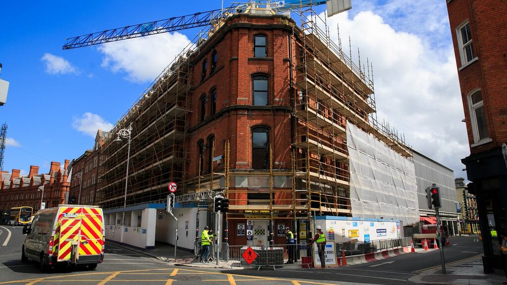 Construction workers on Dublin’s Georges Street on Wednesday. More people will be returning to work on Monday under phase one of the Government’s plan to reopen the country. Photograph: Gareth Chaney/Collins