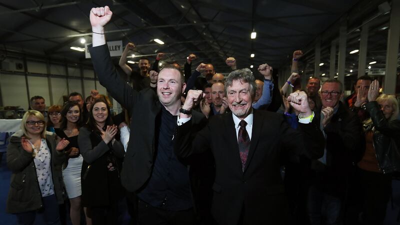 Sinn Féin’s Mickey Brady, right, and Chris Hazzard celebrate their election. Photograph: Brian Lawless/PA Wire