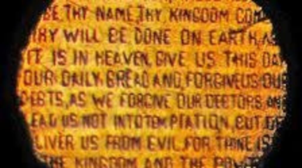 Godfrey Lundberg, an accomplished engraver, hand-engraved the Lord’s Prayer on the tiny head of a gold pin