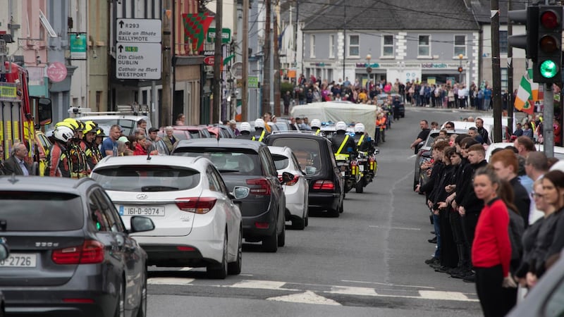 Det Garda Colm Horkan’s remains are driven through Ballaghaderreen on Friday evening after being released from hospital. Photograph: Colin Keegan, Collins Dublin