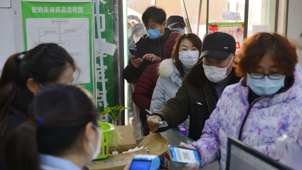 People line up to buy medical masks in Nanjing in the Jiangsu province of China on Wednesday. The city is due to host the World Indoor Championships in March. Photograph: Fang Dongxu/EPA